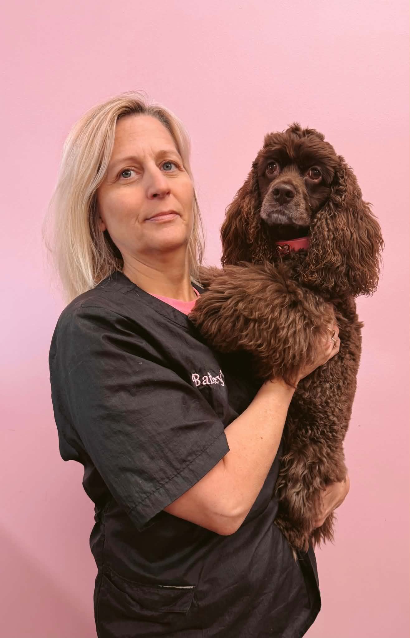 Andrea Sloan holding a cocker spaniel